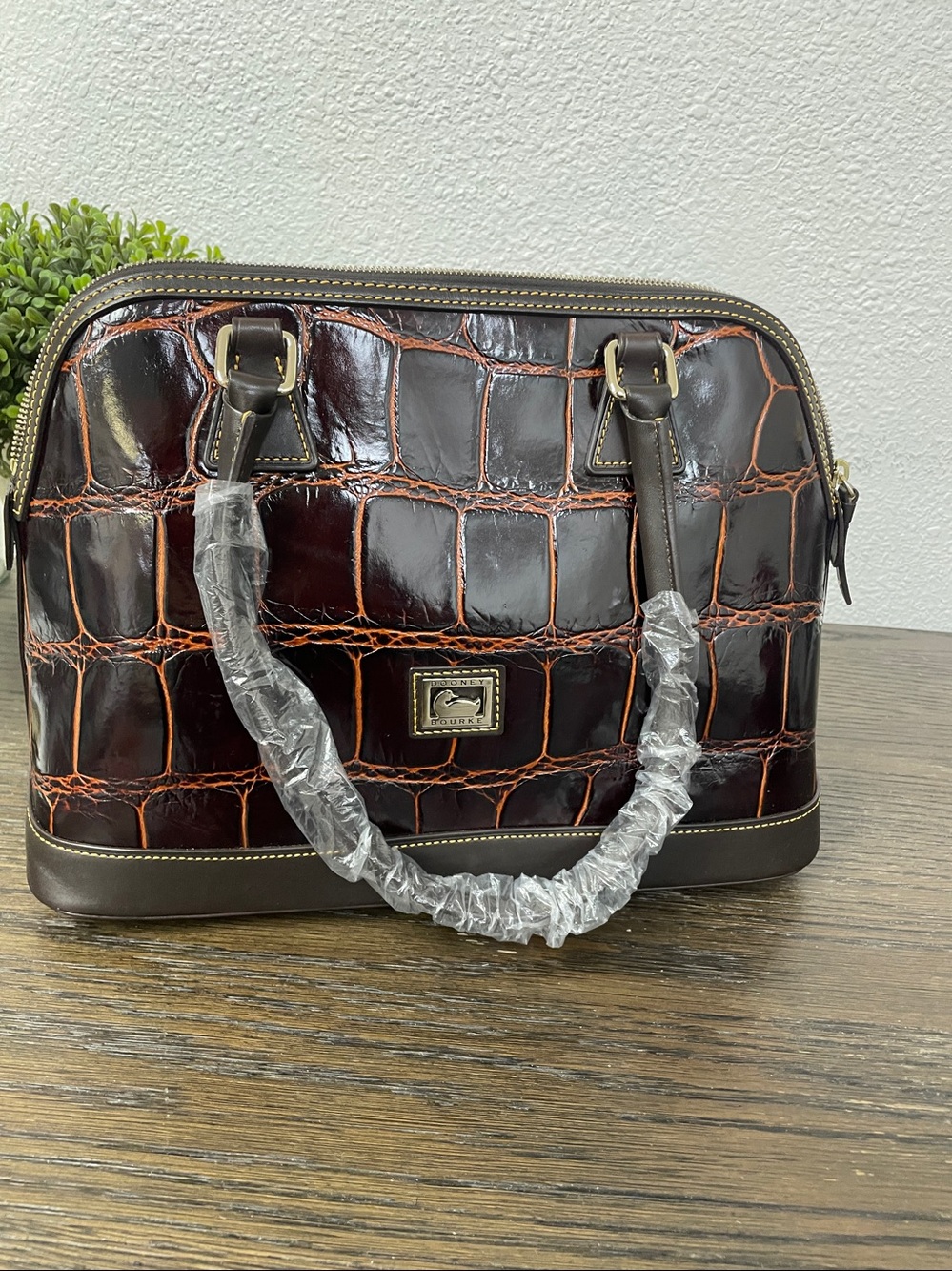 Dooney & Bourke cognc croco-embossed leather dome satchel.